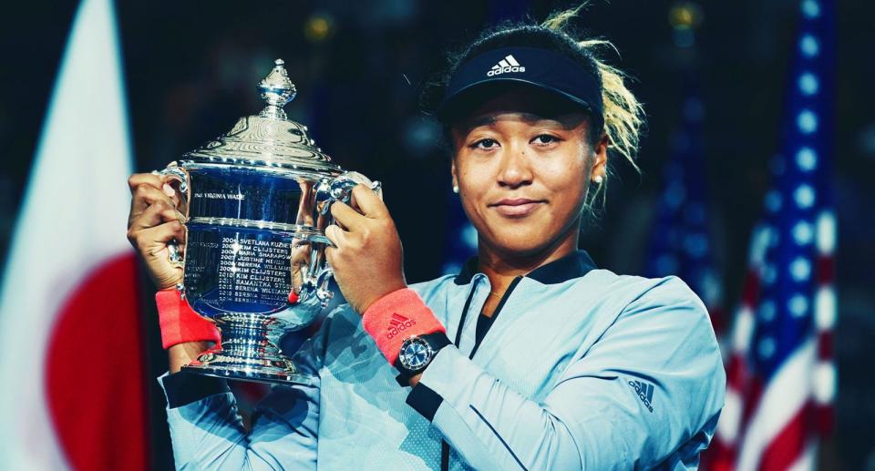 Naomi Osaka shows off her US Open trophy