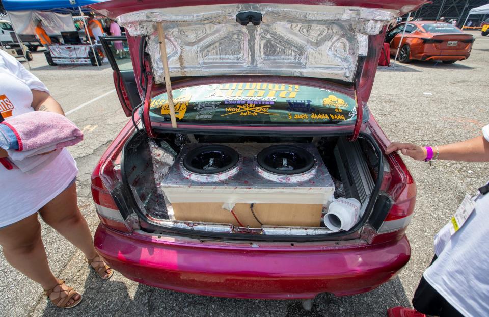 The business end of a Honda complete with a homemade subwoofer box, and a fan-cooled amplifier.