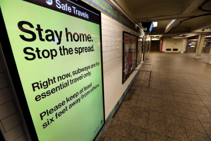 FILE PHOTO: A message is seen on an electronic display inside a mostly empty 42nd Street subway station during the coronavirus outbreak in New York