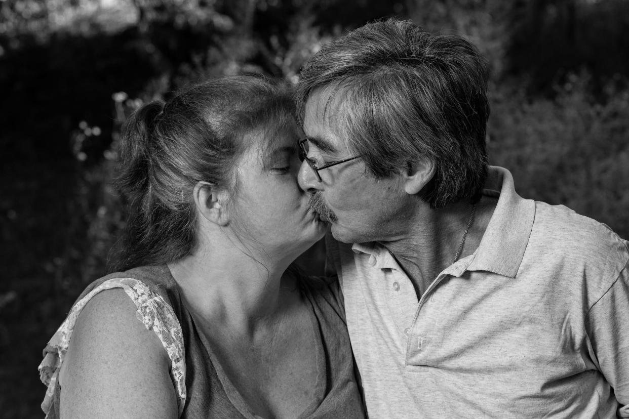 Hospice patient Chuck Ross, who has since died, kisses his wife in this photo featured in the photo exhibition The Last Portrait at The Other Side, 2011 Genesee St. in Utica. The exhibit, on display from the evening of Feb. 9 through March 2, features portraits of people with terminal illnesses taken by local photographer Mark DiOrio with assistance from Hospice & Palliative Care, Inc. in New Hartford.