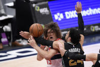 Memphis Grizzlies guard Dillon Brooks (24) fouls Washington Wizards center Robin Lopez (15) during the second half of an NBA basketball game, Tuesday, March 2, 2021, in Washington. (AP Photo/Nick Wass)