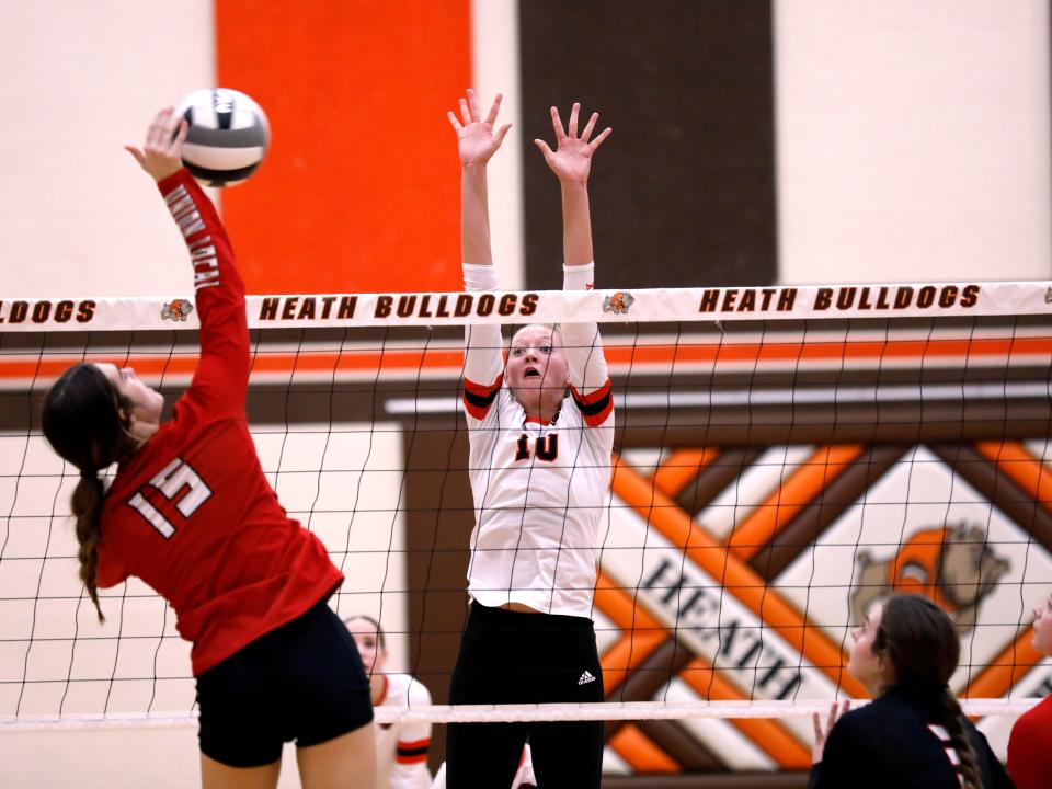 Jerilynn Koehler goes up for a block during New Lexington's 20-25, 21-25, 25-15, 22-25 loss to Union Local in a Division II regional final on Nov. 5, 2022, at Heath High School. Koehler, who had 25 kills in the match, signed with Cleveland State last week.