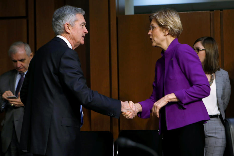 Jerome Powell greets Senator Elizabeth Warren (D-MA) before testifying to the Senate Banking, Housing and Urban Affairs Committee on his nomination to become chairman of the U.S. Federal Reserve in Washington, U.S., November 28, 2017. REUTERS/Joshua Roberts