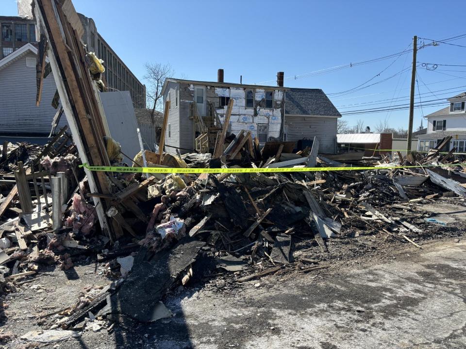 The ruins of the building that caught fire on River Street in Sanford, Maine, are seen here the day after the emergency, on Friday, March 22, 2024.