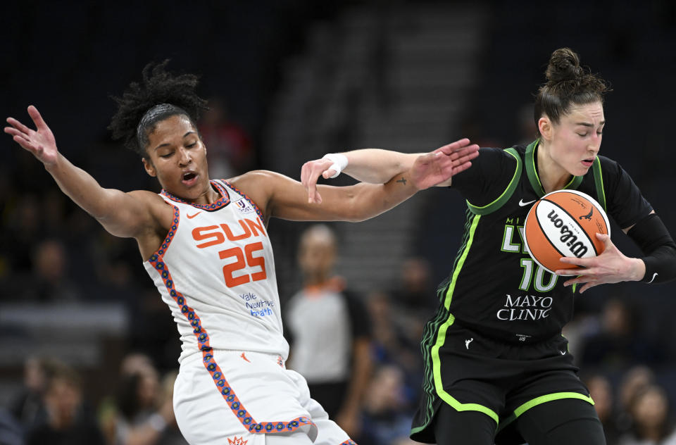 Minnesota Lynx forward Jessica Shepard commits an offensive foul against Connecticut Sun forward Alyssa Thomas during the second half of a WNBA basketball game Thursday, June 1, 2023, in Minneapolis. (Aaron Lavinsky/Star Tribune via AP)