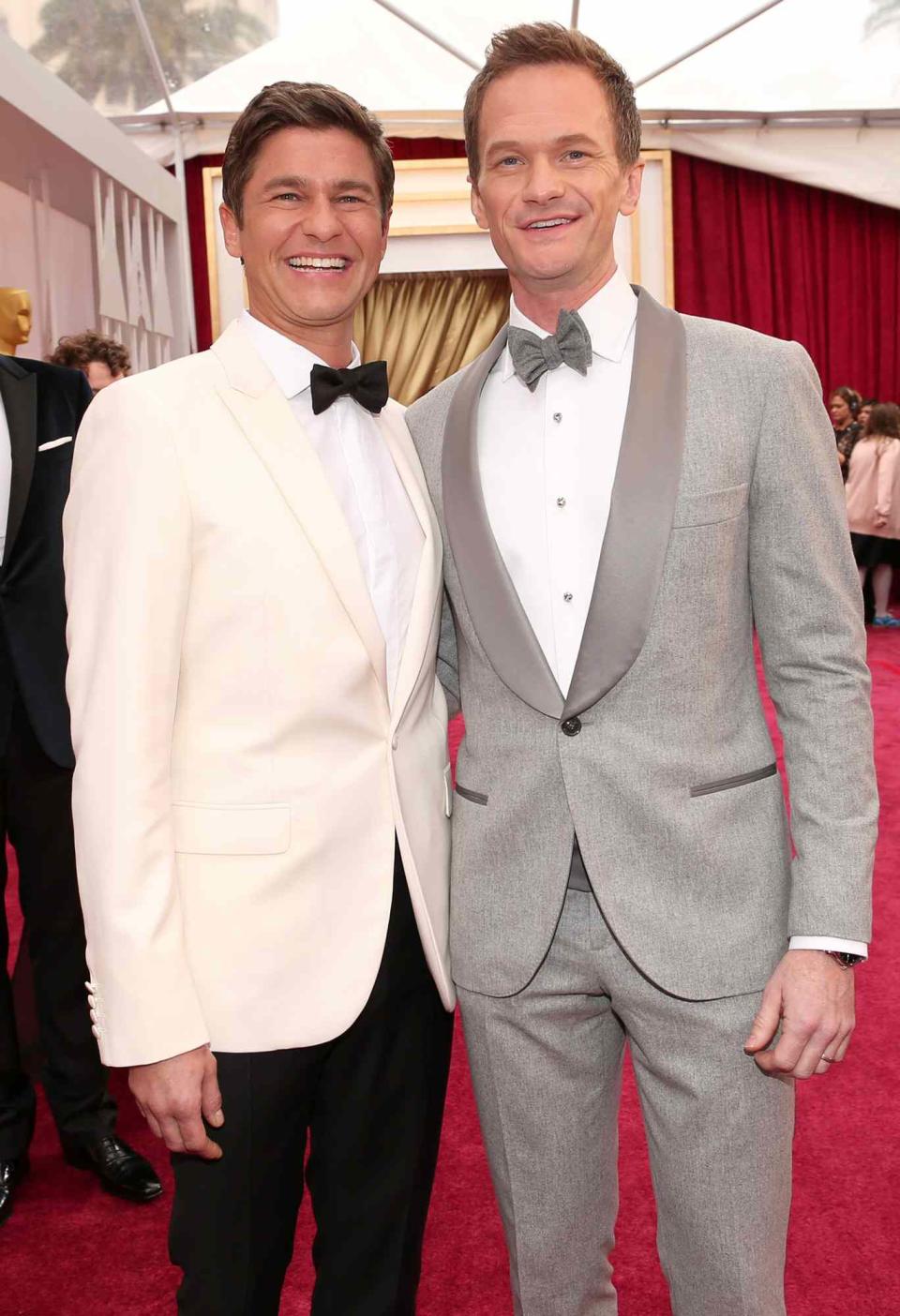 Neil Patrick Harris (R) and actor David Burtka attend the 87th Annual Academy Awards at Hollywood & Highland Center on February 22, 2015 in Hollywood, California