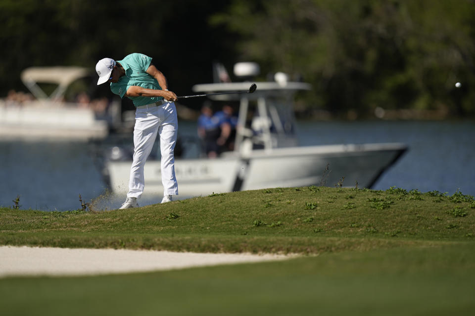 Rickie Fowler hits from the fairway on the 14th hole during the third round of the Dell Technologies Match Play Championship golf tournament in Austin, Texas, Friday, March 24, 2023. (AP Photo/Eric Gay)