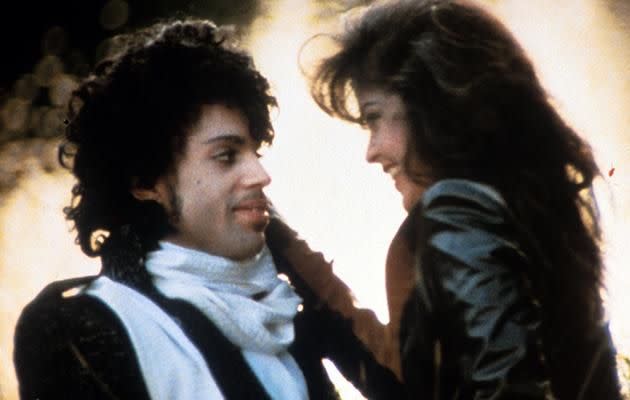 Prince embraces Apollonia Kotero in a scene from the film 'Purple Rain'.