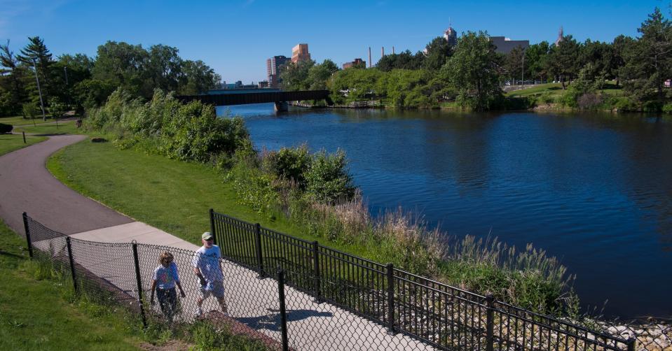 The Lansing River Trail includes miles of paved trail and boardwalk along the Grand River, stretching from South Lansing to Old Town through downtown.