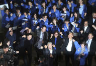 Employees of CTi TV react after the cable news channel halts its broadcast operations at the hall of CTi TV in Taipei, Taiwan, Friday, Dec. 11, 2020. CTi TV, a leading pro-China cable news channel, halted its broadcast operations at midnight Friday after Taiwan''s government refused to renew its license, citing accuracy issues. (AP Photo/Chiang Ying-ying)