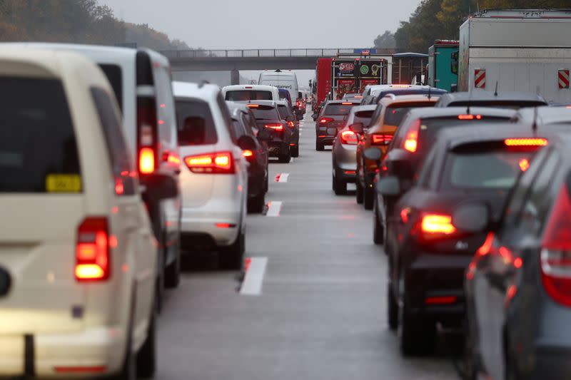 Activists hang on a bridge of A5 highway near Frankfurt causing traffic jams