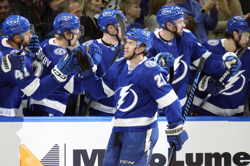 Tampa Bay Lightning center Brayden Point (21) celebrates with the bench after scoring against the Montreal Canadiens during the first period of an NHL hockey game Wednesday, Dec. 28, 2022, in Tampa, Fla. (AP Photo/Chris O'Meara)