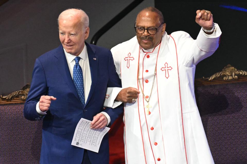 US president Joe Bidenstands with Bishop Ernest Morris Sr during a church service and campaign event at Mount Airy Church of God in Christ in Philadelphia, Pennsylvania (AFP/Getty)