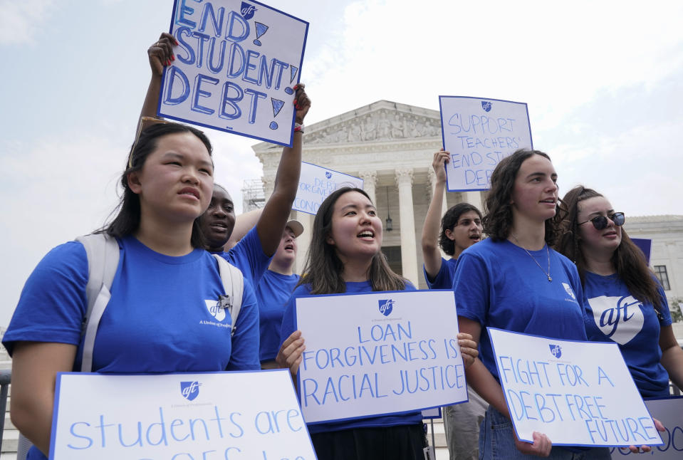 People demonstrate outside the Supreme Court, Friday, June 30, 2023, in Washington. A sharply divided Supreme Court has ruled that the Biden administration overstepped its authority in trying to cancel or reduce student loan debts for millions of Americans. Conservative justices were in the majority in Friday's 6-3 decision that effectively killed the $400 billion plan that President Joe Biden announced last year. (AP Photo/Jacquelyn Martin)