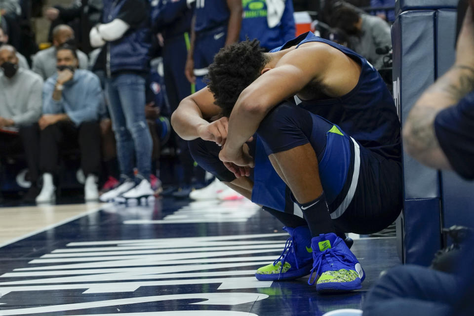 Minnesota Timberwolves center Karl-Anthony Towns takes a moment after a hard fall during the first half of an NBA basketball game against the Atlanta Hawks, Monday, Dec. 6, 2021, in Minneapolis. The Hawks won 121-110. (AP Photo/Craig Lassig)