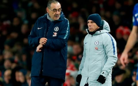 Chelsea's Italian head coach Maurizio Sarri (L) chats with Chelsea's Italian assistant first team coach Gianfranco Zola - Credit: AFP