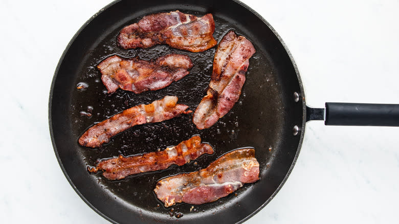 Bacon frying in pan