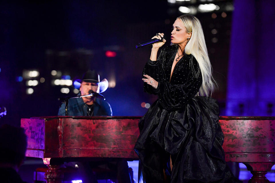 Carrie Underwood performs at the 2021 American Music Awards on Nov. 21 with Jason Aldean. - Credit: ABC