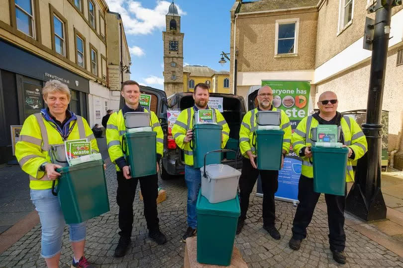 The community waste team encouraging local people to use their food caddy and recycle at home