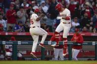 Los Angeles Angels' Zach Neto, right, celebrates his solo home run with third base coach Eric Young Sr. during the third inning of a baseball game against the Philadelphia Phillies, Tuesday, April 30, 2024, in Anaheim, Calif. (AP Photo/Ryan Sun)