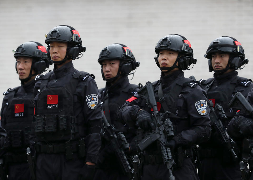 Chinese security forces performs during a joint anti-terrorist drill in the Zelezara Smederevo steel mill, in the city of Smederevo, 45 kilometers east of Belgrade, Serbia, Thursday, Nov. 28, 2019. Serbian and Chinese security forces are holding a joint anti-terrorist drills in the Balkan country in a sign of Beijing's increasing influence in the volatile region. (AP Photo/Darko Vojinovic)