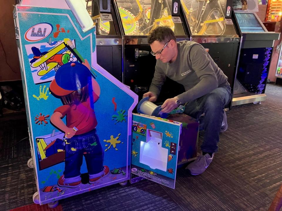 Andrew Rosenfeld, the general manager of Marvin’s Marvelous Mechanical Museum in Farmington Hills, works on a game on Thursday, Feb. 15, 2024. 
The arcade that has been popular in the area going back to the late 1980’s is facing a vote on Thursday with the city of Farmington Hills along with other businesses in the shopping area at Orchard Lake and 14 Mile that depending on how the vote goes could turn the location into a Meijer.