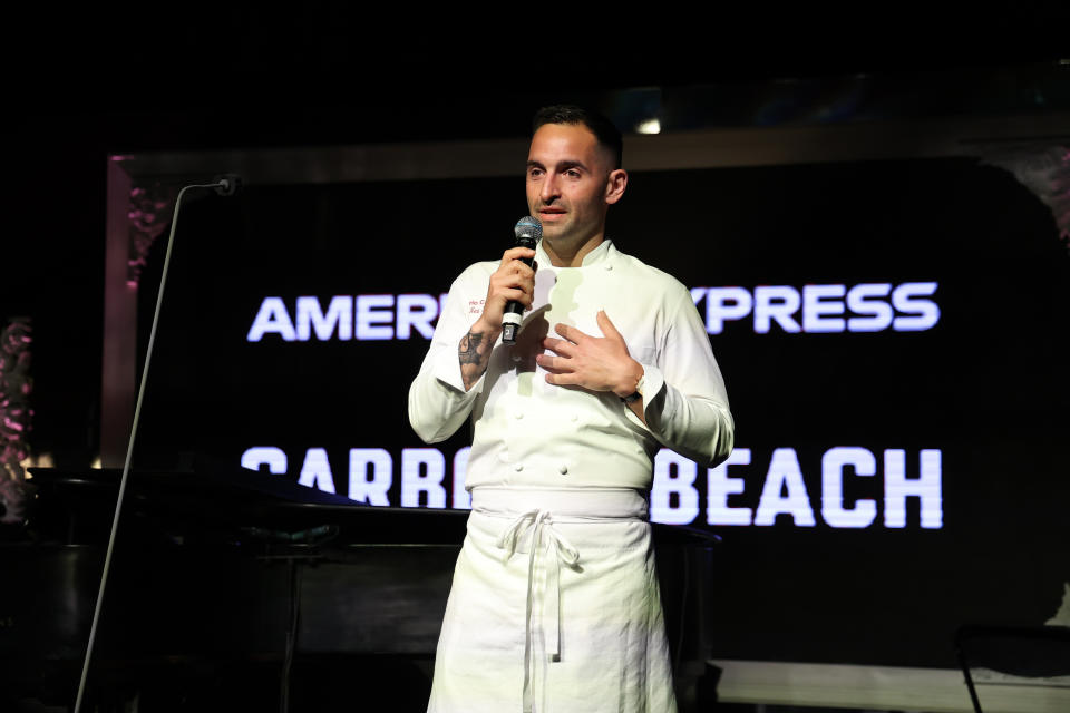 MIAMI BEACH, FLORIDA - MAY 05: Chef Mario Carbone speaks onstage during Day 1 of American Express Presents CARBONE Beach at Carbone on May 05, 2022 in Miami Beach, Florida. (Photo by John Parra/Getty Images for Carbone Beach)