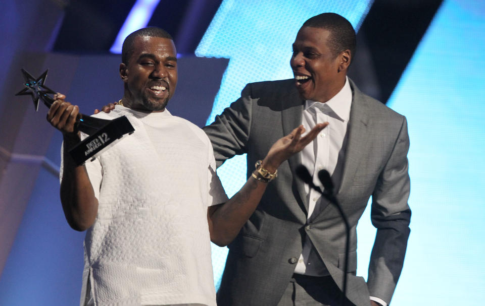 Kanye West, left, and Jay-Z accept the award for best group for "The Throne" at the BET Awards on Sunday, July 1, 2012, in Los Angeles. (Photo by Matt Sayles/Invision/AP)