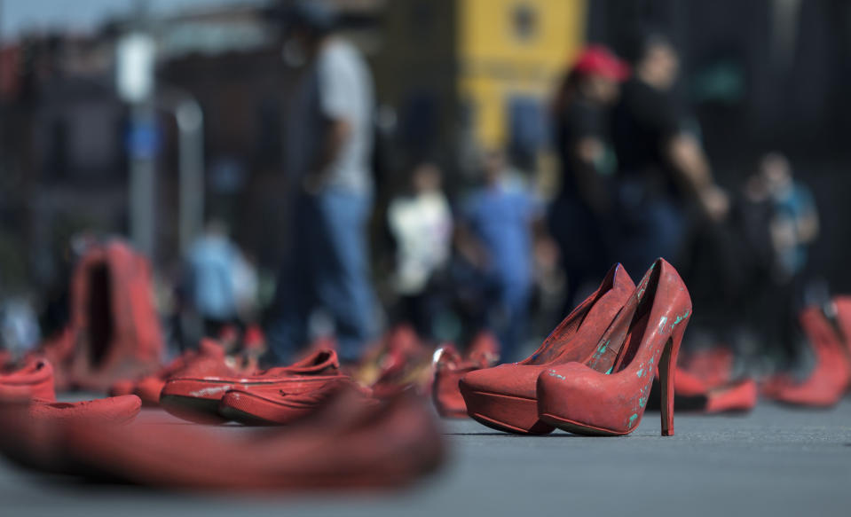 Women's red shoes are spread out in the Zocalo where they were placed by people to protest violence against women in Mexico City, Saturday, Jan. 11, 2020. There are 10 women killed daily on average across Mexico, and only one in 10 such crimes are solved, according to the National Citizens’ Observatory on Femicide. (AP Photo/Christian Palma)