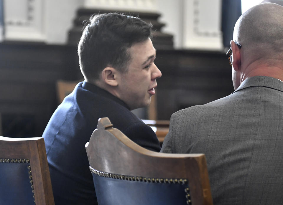 Kyle Rittenhouse in profile, seated in court.