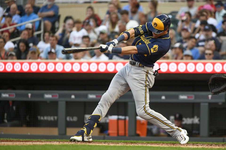 Milwaukee Brewers' Christian Yelich hits a single off Minnesota Twins pitcher Pablo Lopez during the fifth inning of a baseball game Tuesday, June 13, 2023, in Minneapolis. (AP Photo/Craig Lassig)