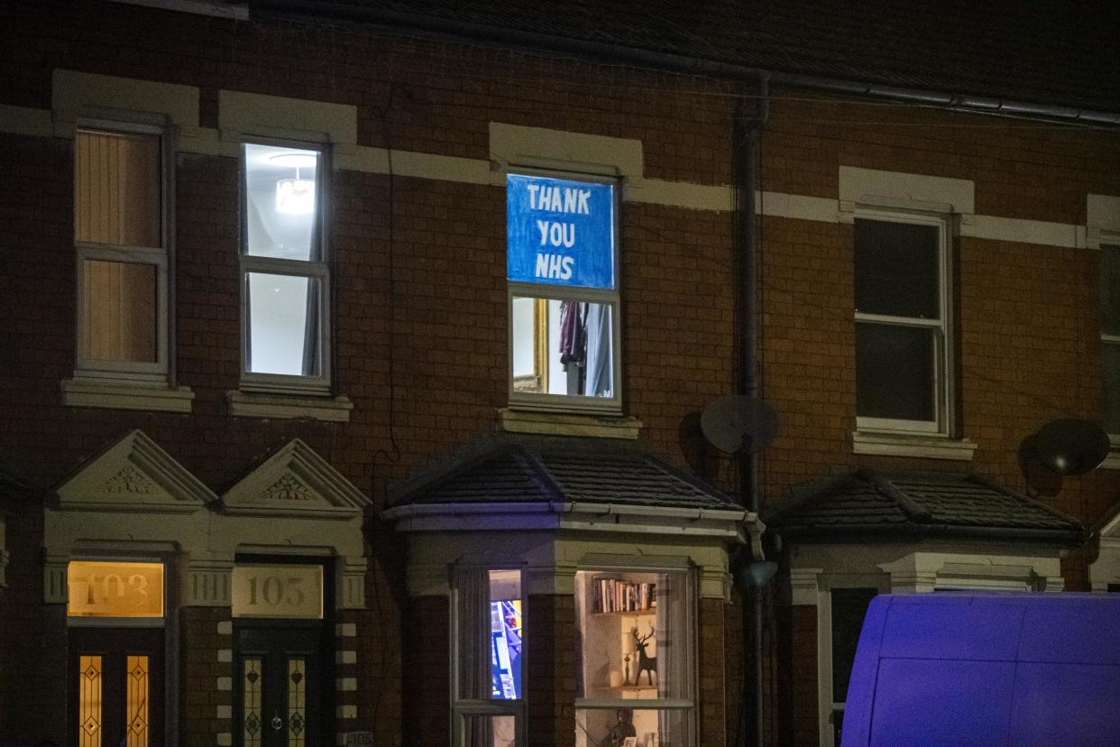 A 'Thank you NHS' banner in the window of a house in Droitwich Road in Worcester, Worcestershire, as the road remains quiet during the first Clap for Heroes during the third national lockdown in England, to reduce the spread of COVID-19.