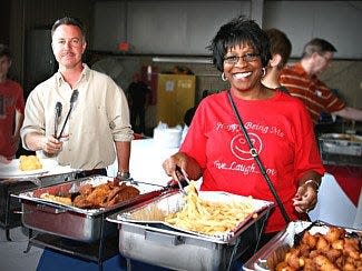 Smyrna Rotary members Carolyn Peebles, right, and state Rep. Mike Sparks at a Wings of Freedom Fish Fry.