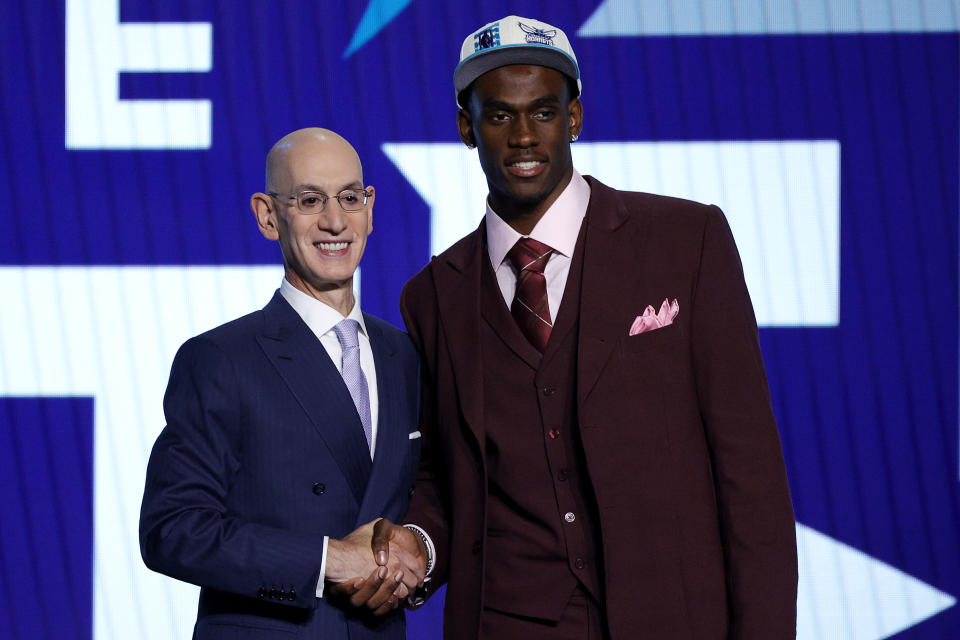 NEW YORK, NEW YORK - JUNE 23: NBA commissioner Adam Silver (L) and Jalen Duren pose for photos after Duren was drafted with the 13th overall pick by the Charlotte Hornets during the 2022 NBA Draft at Barclays Center on June 23, 2022 in New York City. NOTE TO USER: User expressly acknowledges and agrees that, by downloading and or using this photograph, User is consenting to the terms and conditions of the Getty Images License Agreement. (Photo by Sarah Stier/Getty Images)