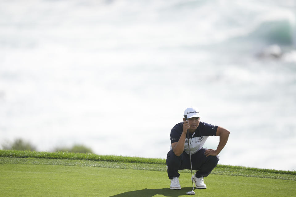 Kurt Kitayama waits to putt on the eighth green on the Pebble Beach Golf Links during the first round of the AT&T Pebble Beach National Pro-Am golf tournament Thursday, Feb. 1, 2024, in Pebble Beach, Calif. (AP Photo/Ryan Sun)