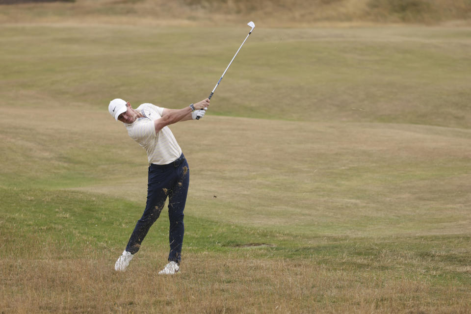 Rory McIlroy of Northern Ireland plays a shot on the 5th fairway during the final round of the British Open golf championship on the Old Course at St. Andrews, Scotland, Sunday July 17, 2022. (AP Photo/Peter Morrison)