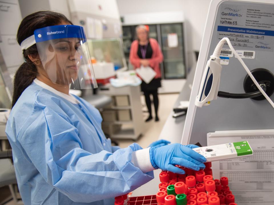 LAKE SUCCESS, NY - MARCH 11: A lab technician begins semi-automated testing for COVID-19 at Northwell Health Labs on March 11, 2020 in Lake Success, New York. An emergency use authorization by the FDA allows Northwell to move from manual testing to semi-automated. (Photo by Andrew Theodorakis/Getty Images)