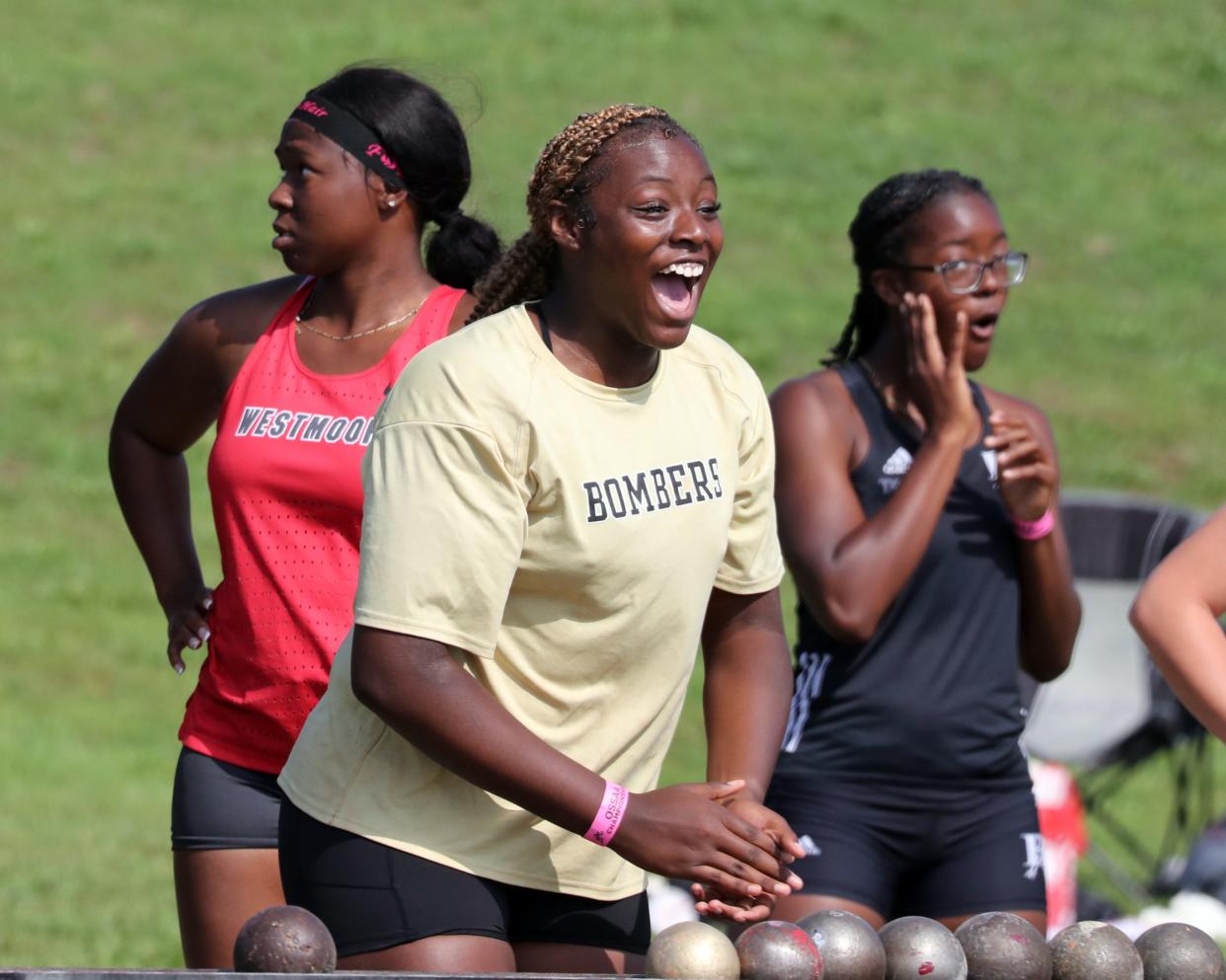 Midwest City's De'Yanna Douglas reacts after  the announcement of her state record shot put of 46' 9" during the State 5A, 6A Track Meet at Yukon High School on May 12, 2023 in Yukon, Okla.  [Steve Sisney/For The Oklahoman]