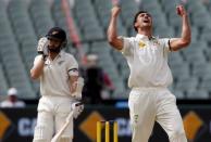 Australia's Mitchell Starc (R) celebrates dismissing New Zealand's Kane Williamson LBW for 22 runs during the first day of the third cricket test match at the Adelaide Oval, in South Australia, November 27, 2015. REUTERS/David Gray