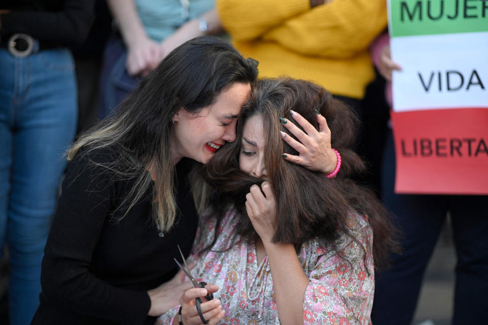 Protesters during a demonstration in Madrid in support of Mahsa Amini on Oct. 1, 2022. (Oscar del Pozo / AFP - Getty Images)