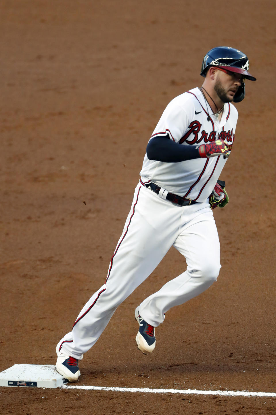 Atlanta Braves' Tyler Flowers rounds third base after hitting a home run in the second inning of a baseball game against the Toronto Blue Jays Tuesday, Aug. 4, 2020, in Atlanta. (AP Photo/John Bazemore)