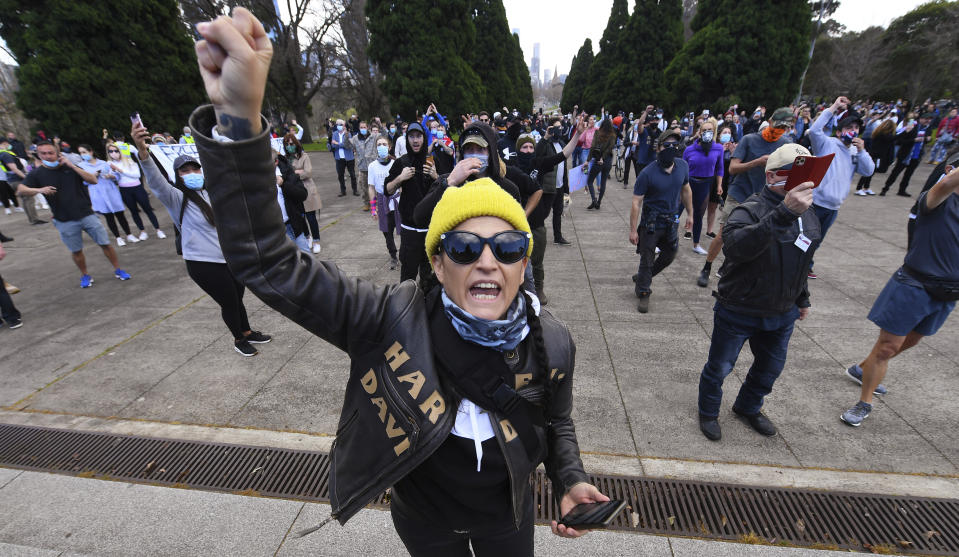 People gather at a so-called "Freedom Day" protest in Melbourne, Saturday, Sept. 5, 2020. Police in Australia's hardest-hit Victoria state are urging people to stay away from rallies protesting the lockdown in Melbourne. (James Ross/AAP Image via AP)