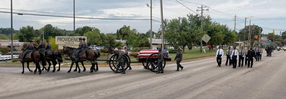 N.C. State Highway Patrolís Caisson Unit enters Providence Baptist Church before the funeral for slain Wake Sheriffís Deputy Ned Byrd in Raleigh, N.C., Friday, August 19, 2022.