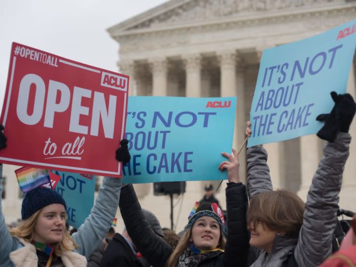 eople gather outside the US Supreme Court before Masterpiece Cakeshop vs. Colorado Civil Rights Commission is heard on December 5, 2017 in Washington, DC. The US Supreme Court is to hear arguments on Tuesday in a case that has been described as the most significant for gay rights since it approved same-sex marriage two years ago. The landmark case pits a gay couple, Dave Mullins and Charlie Craig, against a Colorado bakery owner who refused in July 2012 to make a cake for their same-sex wedding reception. / AFP PHOTO / mari matsuri (Photo credit should read MARI MATSURI/AFP/Getty Images)