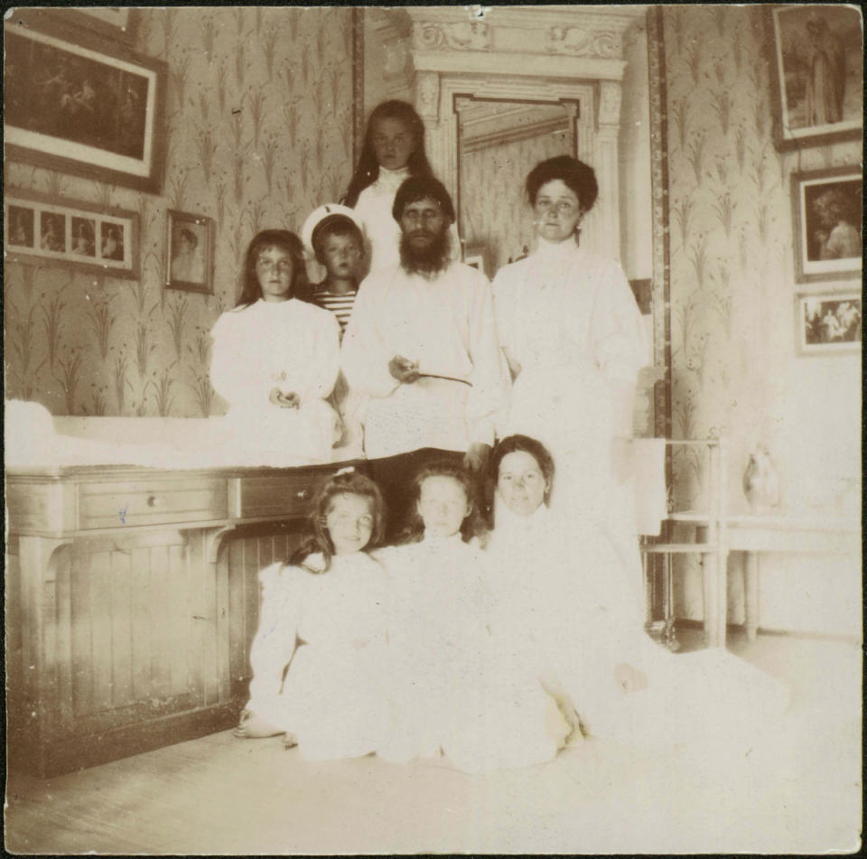 Grigory Rasputin with Empress Alexandra Fyodorovna, her five children and seated right governess Maria Vishnyakova, 1910. Found in the collection of State Archive of the Russian Federation (GARF). (Photo by Fine Art Images/Heritage Images/Getty Images)