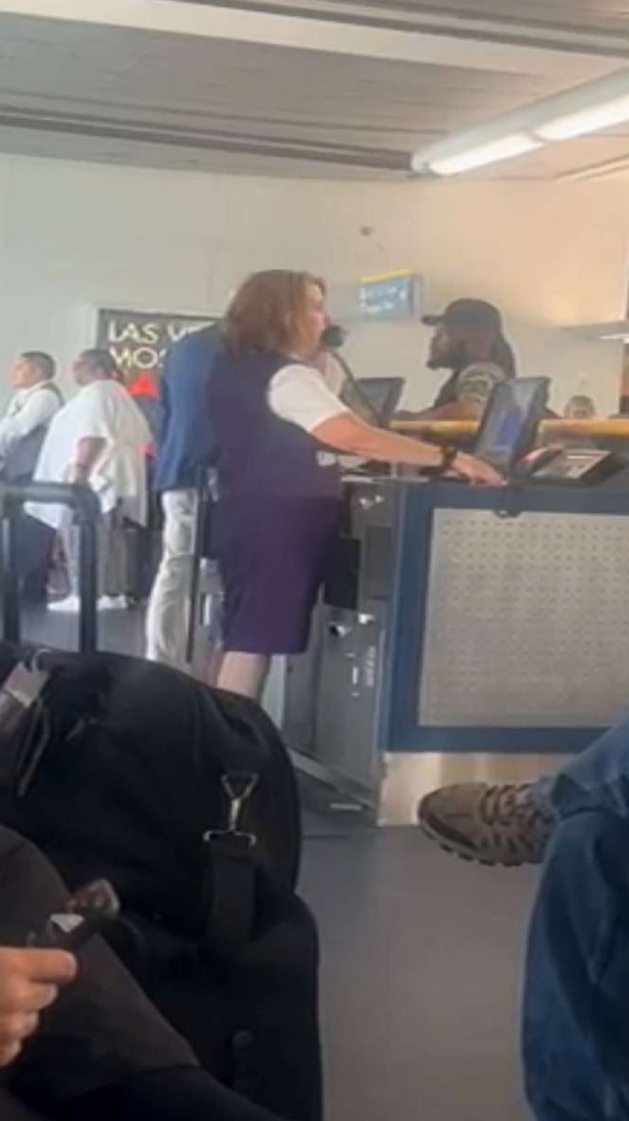 PHOTO: In this screen grab from a video, an airline staff member is shown after Delta Airline passengers passed out from the heat after sitting on the tarmac in 115 degree temperatures in Las Vegas, on July 17, 2023. (April Love)