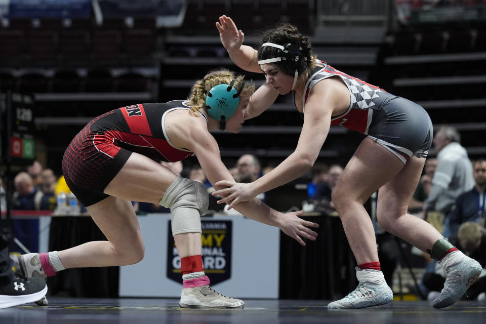 Easton's Aubre Krazer, left, battles Hazleton Area's Miah Molinaro, right, during the first found of the PIAA High School Wrestling Championships in Hershey, Pa., Thursday, March 7, 2024. Girls’ wrestling has become the fastest-growing high school sport in the country. (AP Photo/Matt Rourke)