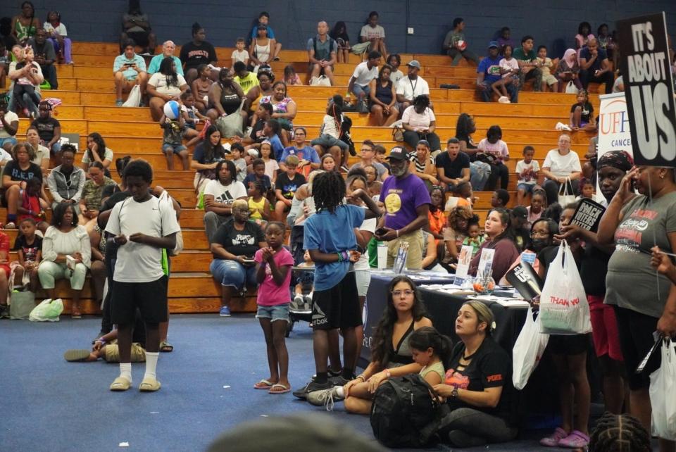 Hundreds of people attended the 25th annual Stop the Violence Back to School Rally on Saturday at Santa Fe College.
