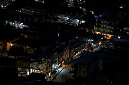 Lights from shops illuminate the city of Leh, the largest town in the region of Ladakh, nestled high in the Indian Himalayas, India September 26, 2016. REUTERS/Cathal McNaughton