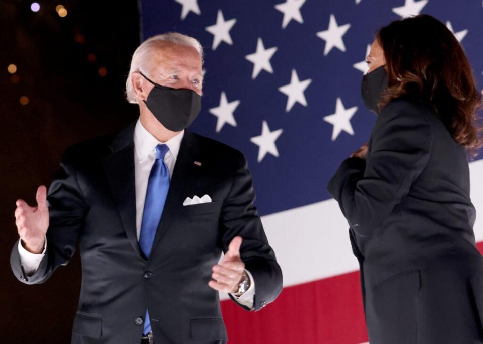 Democratic presidential nominee Joe Biden and Democratic Vice Presidential nominee Kamala Harris confer on stage outside the Chase Center after Biden delivered his acceptance speech on the fourth night of the Democratic National Convention from the Chase Center on August 20, 2020 in Wilmington, Delaware. (Win McNamee/Getty Images)